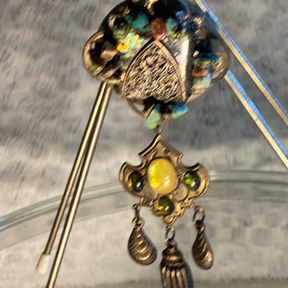 Vintage beaded brooch with beautiful stones.3 inches long.